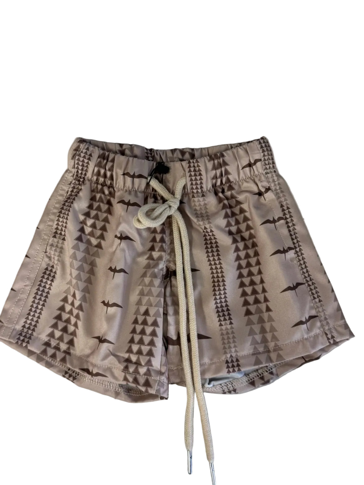 Beige shorts with black geometric pattern on a white background